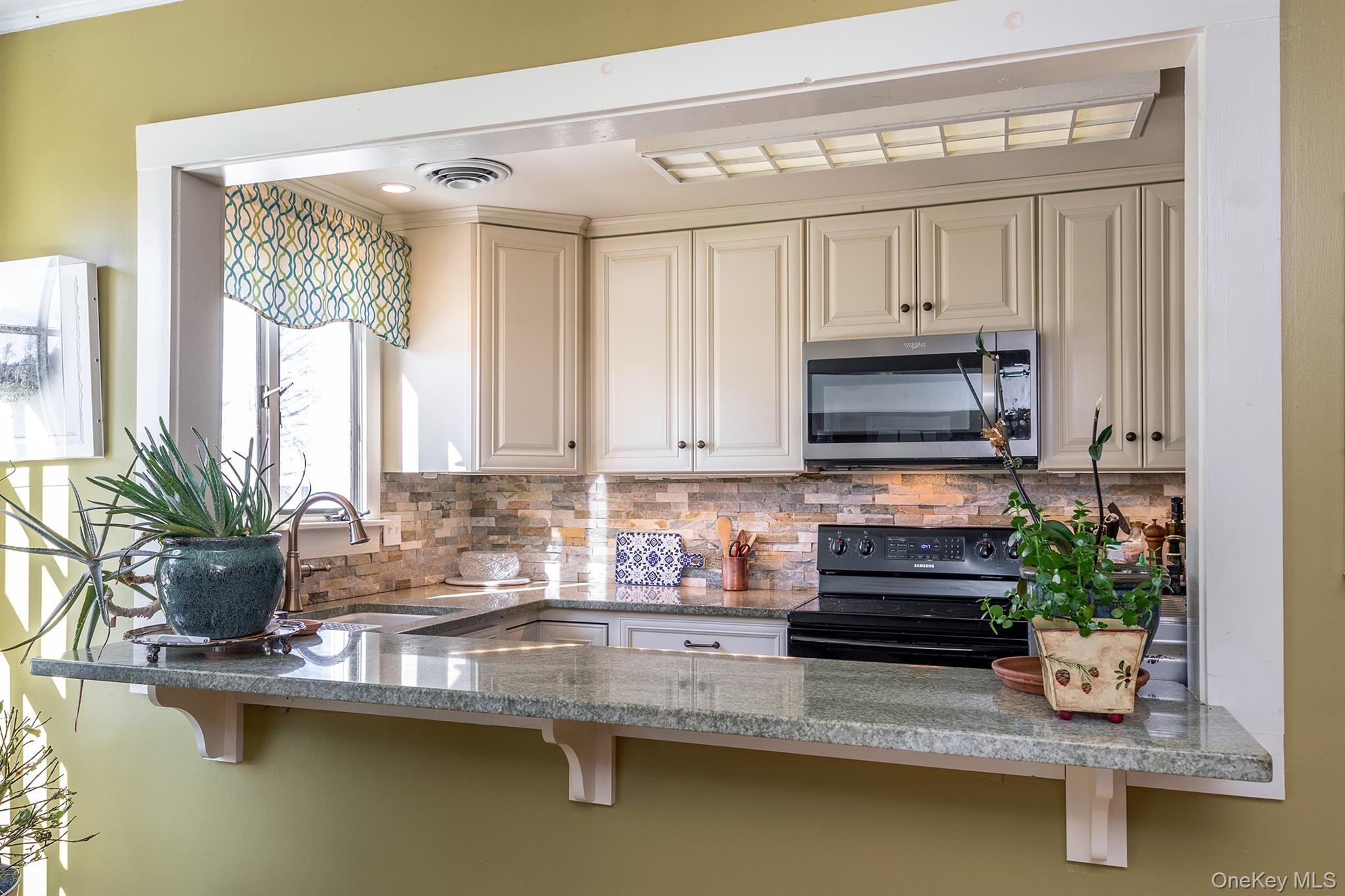 4258 Highway 44 Millbrook, NY 12545 - Photo 33 of 36 a kitchen with a large window appliances and cabinets