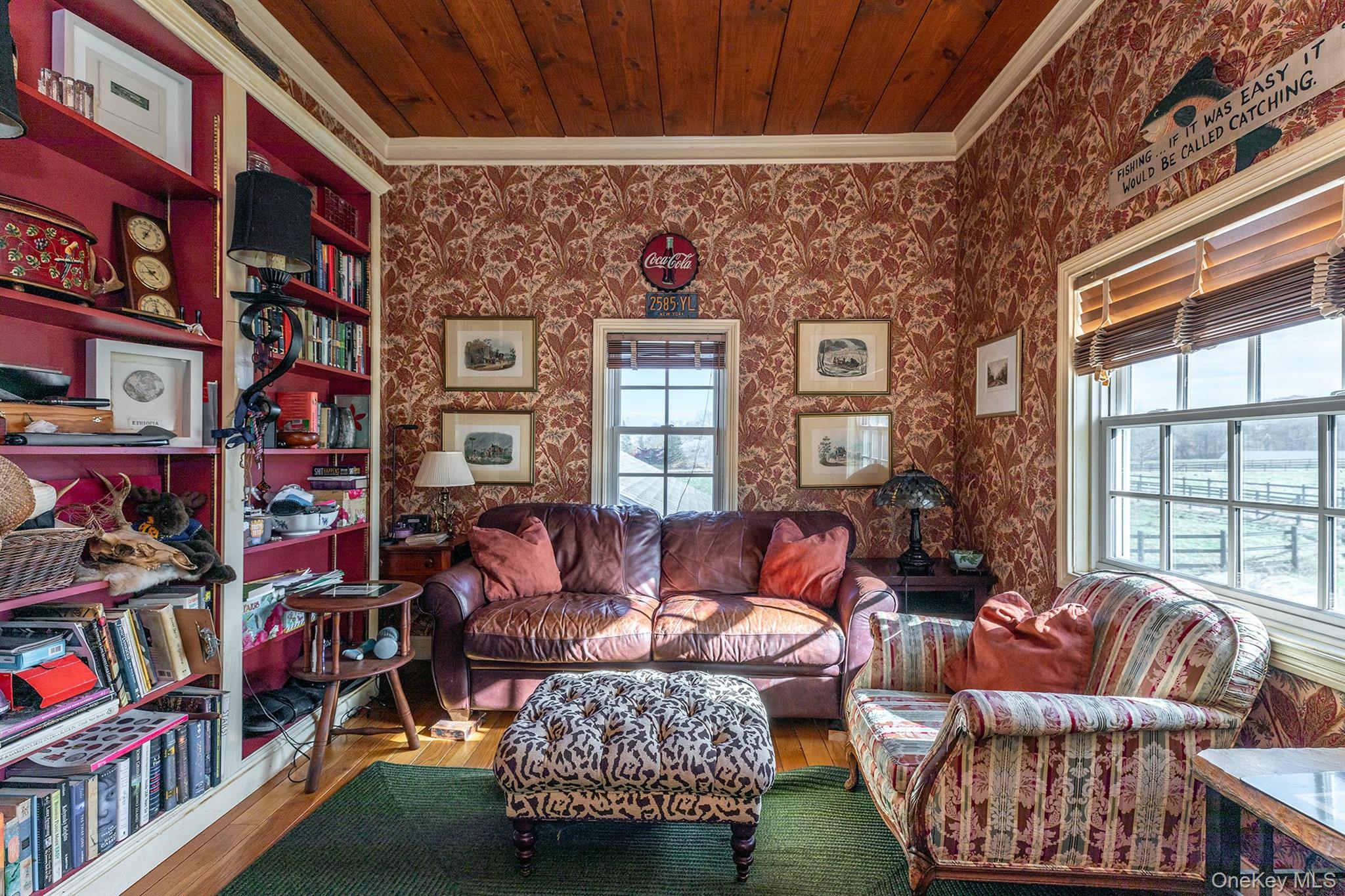 4258 Highway 44 Millbrook, NY 12545 - Photo 35 of 36 a living room with furniture a bookshelf and a window