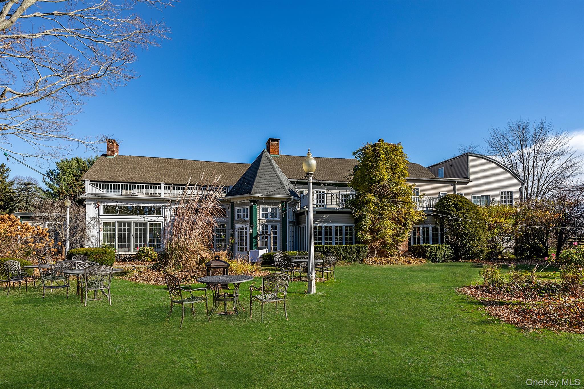 4258 Highway 44 Millbrook, NY 12545 - Photo 6 of 36 a view of a house with a big yard potted plants and large tree