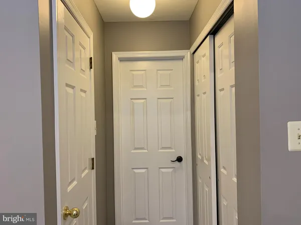 a view of a bathroom with a sink and glass door