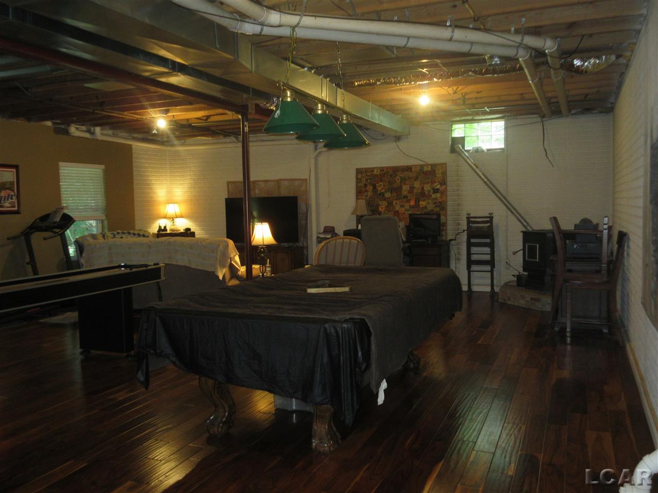 5995 Pawson Road Tipton, MI 49287 - Photo 33 of 53 Hardwood Flooring