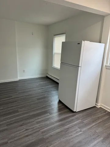 an empty room with wooden floor