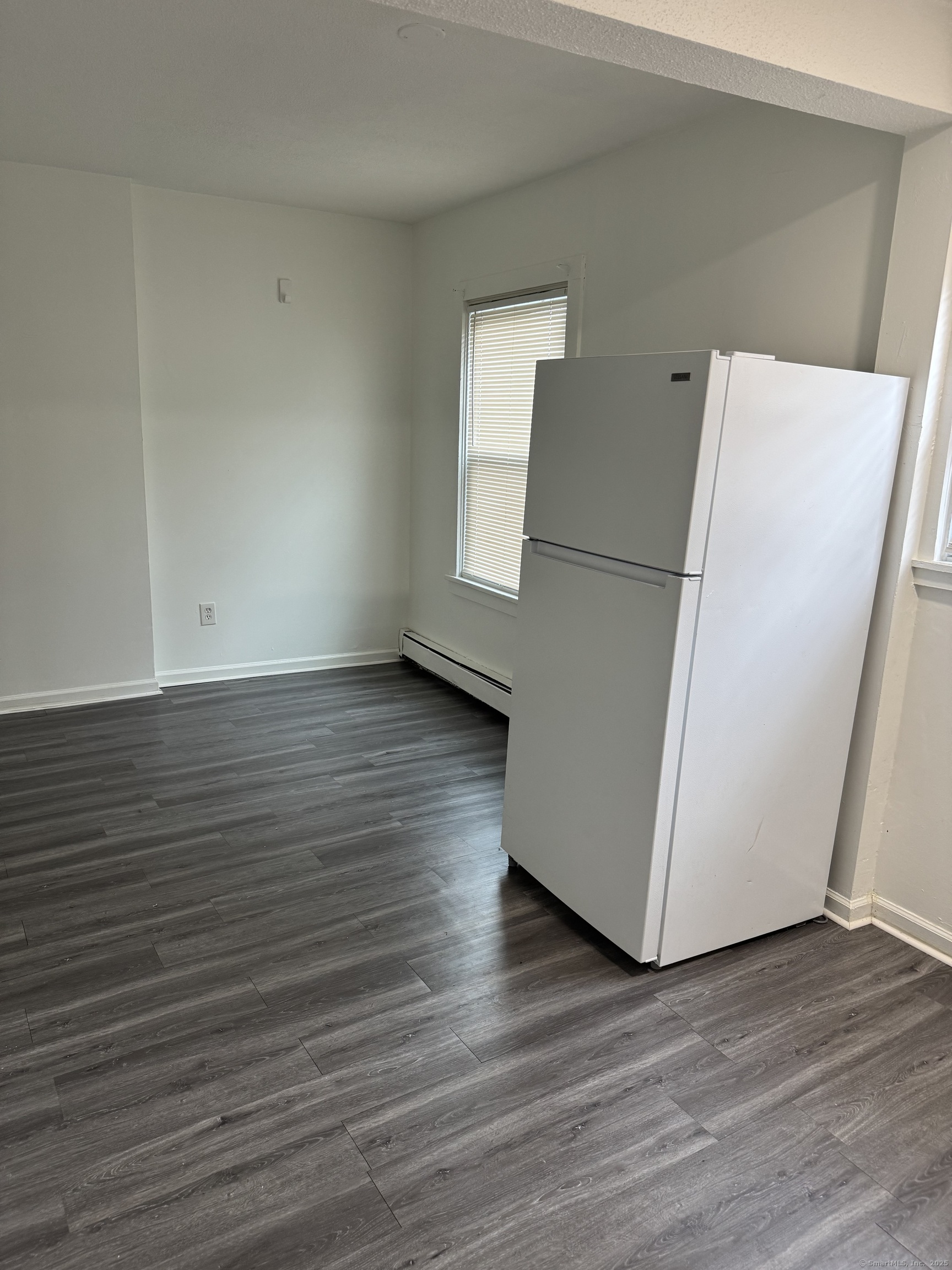 666 Main Street, Unit C4 Middletown, CT 06457 - Photo 3 of 6 an empty room with wooden floor