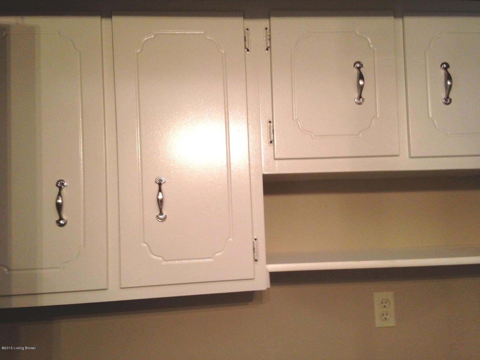 244 Glenview Road Louisville, KY 40229 - Photo 11 of 26 CABINETS IN THE LAUNDRY CLOSET