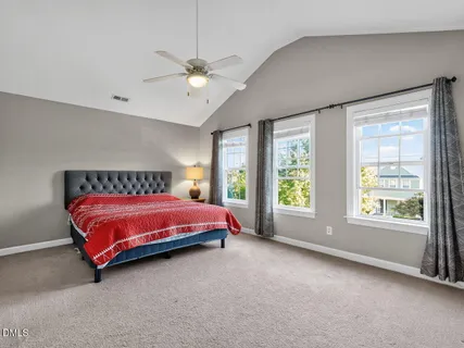 a kitchen with stainless steel appliances granite countertop a sink a stove and cabinets with wooden floor