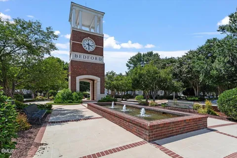 a view of a balcony with floor to ceiling window and wooden floor
