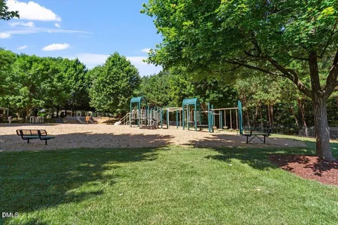 a view of bench sitting next to a road