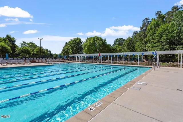 a view of a playground with a slide and swing