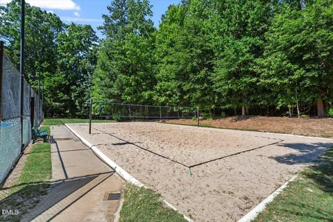 a view of a patio with table and chairs under an umbrella