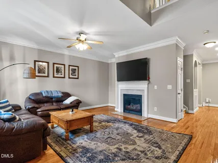 a bedroom with a workspace and a window