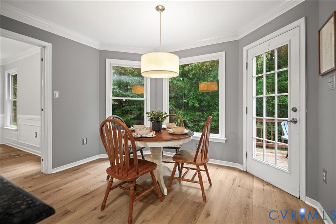 5506 Windy Ridge Terrace Midlothian, VA 23112 - Photo 12 of 50 a view of a dining room with furniture window and wooden floor