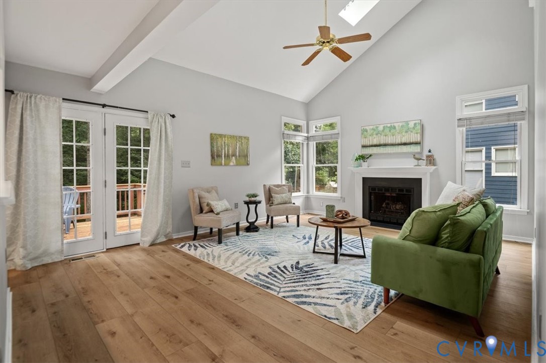 5506 Windy Ridge Terrace Midlothian, VA 23112 - Photo 21 of 50 a living room with furniture and a fireplace