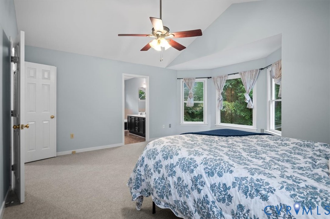 5506 Windy Ridge Terrace Midlothian, VA 23112 - Photo 29 of 50 a view of a bedroom with a bed and a large window