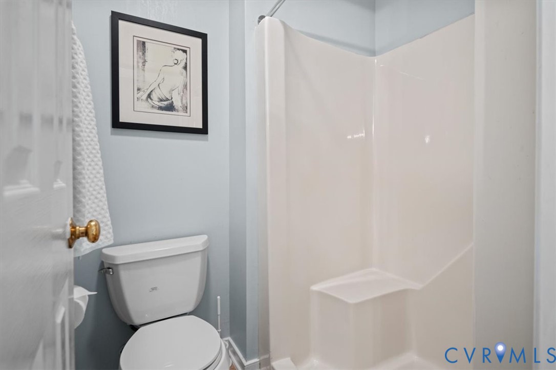 5506 Windy Ridge Terrace Midlothian, VA 23112 - Photo 31 of 50 a white toilet sitting next to a white wall