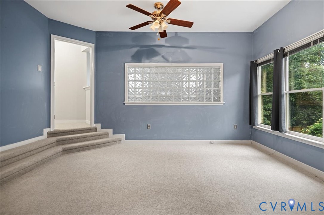 5506 Windy Ridge Terrace Midlothian, VA 23112 - Photo 37 of 50 an empty room with windows and fan
