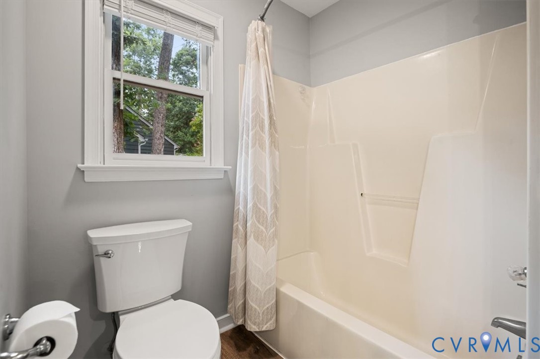 5506 Windy Ridge Terrace Midlothian, VA 23112 - Photo 41 of 50 a white toilet sitting next to a bath tub