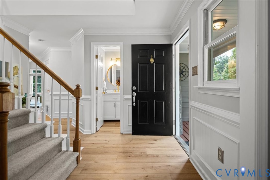 5506 Windy Ridge Terrace Midlothian, VA 23112 - Photo 5 of 50 a view of an entryway with wooden floor and a livingroom