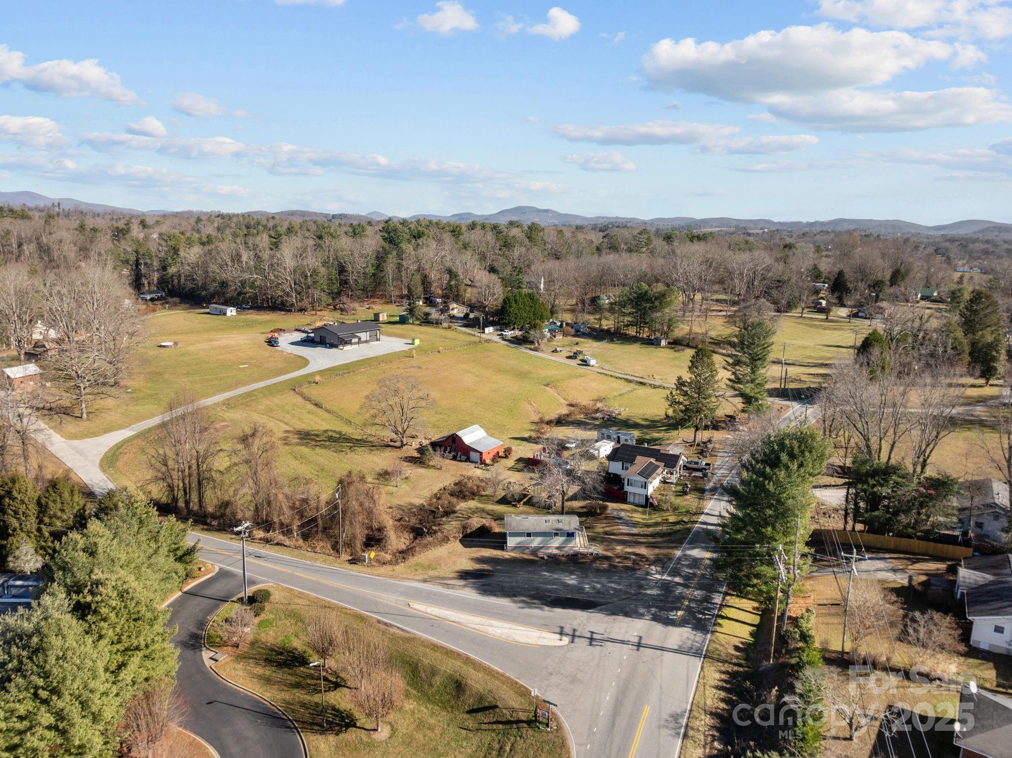 701 Dana Road Hendersonville, NC 28792 - Photo 12 of 27 a view of a swimming pool with a yard