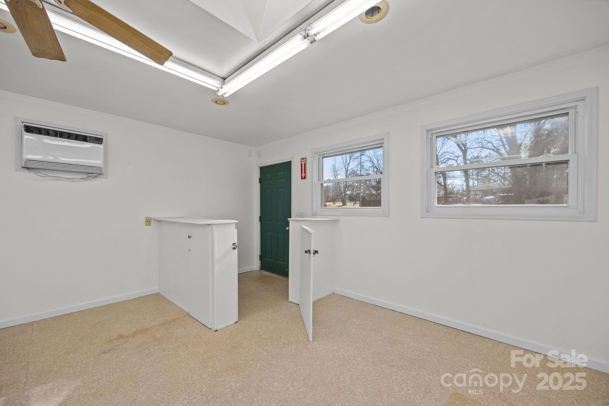 701 Dana Road Hendersonville, NC 28792 - Photo 19 of 27 a view of empty room with windows
