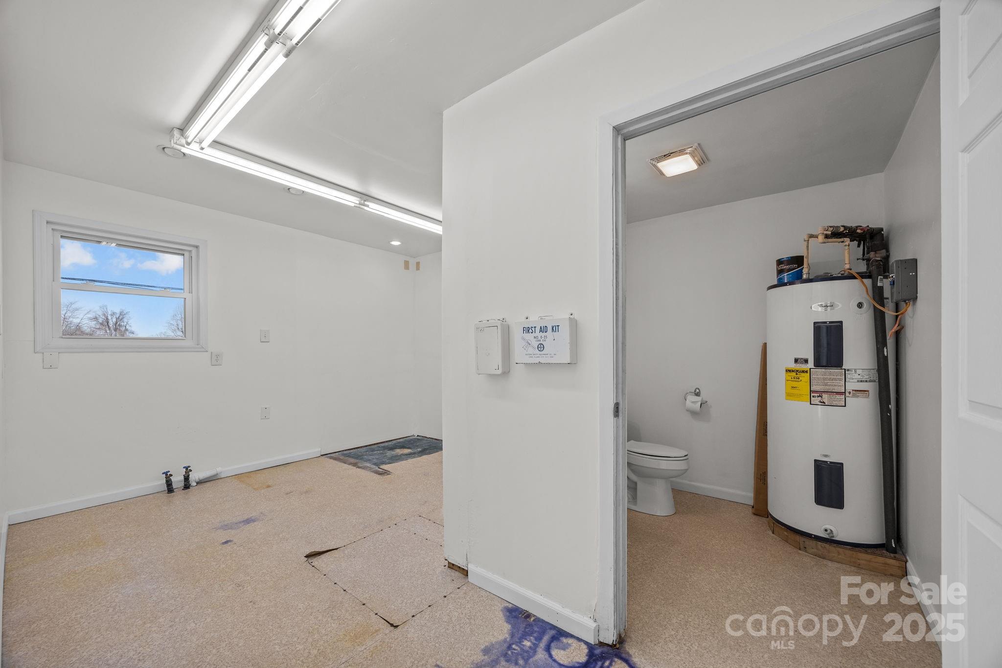 701 Dana Road Hendersonville, NC 28792 - Photo 22 of 27 a view of a storage & utility room with a window