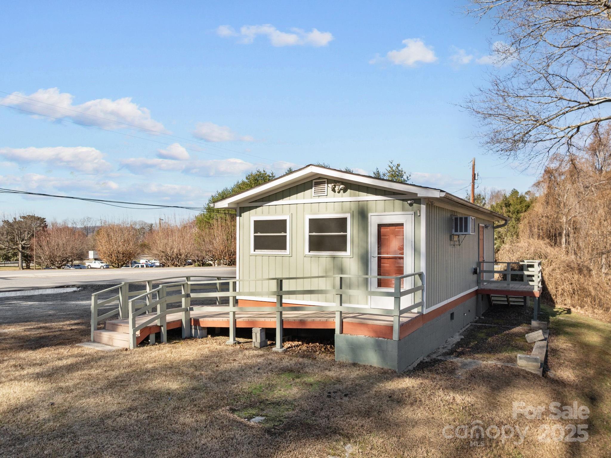 701 Dana Road Hendersonville, NC 28792 - Photo 6 of 27 a view of a house with a yard