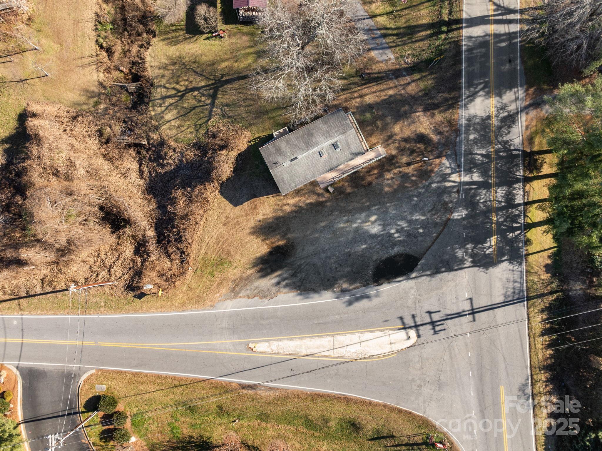 701 Dana Road Hendersonville, NC 28792 - Photo 9 of 27 a view of roof and yard