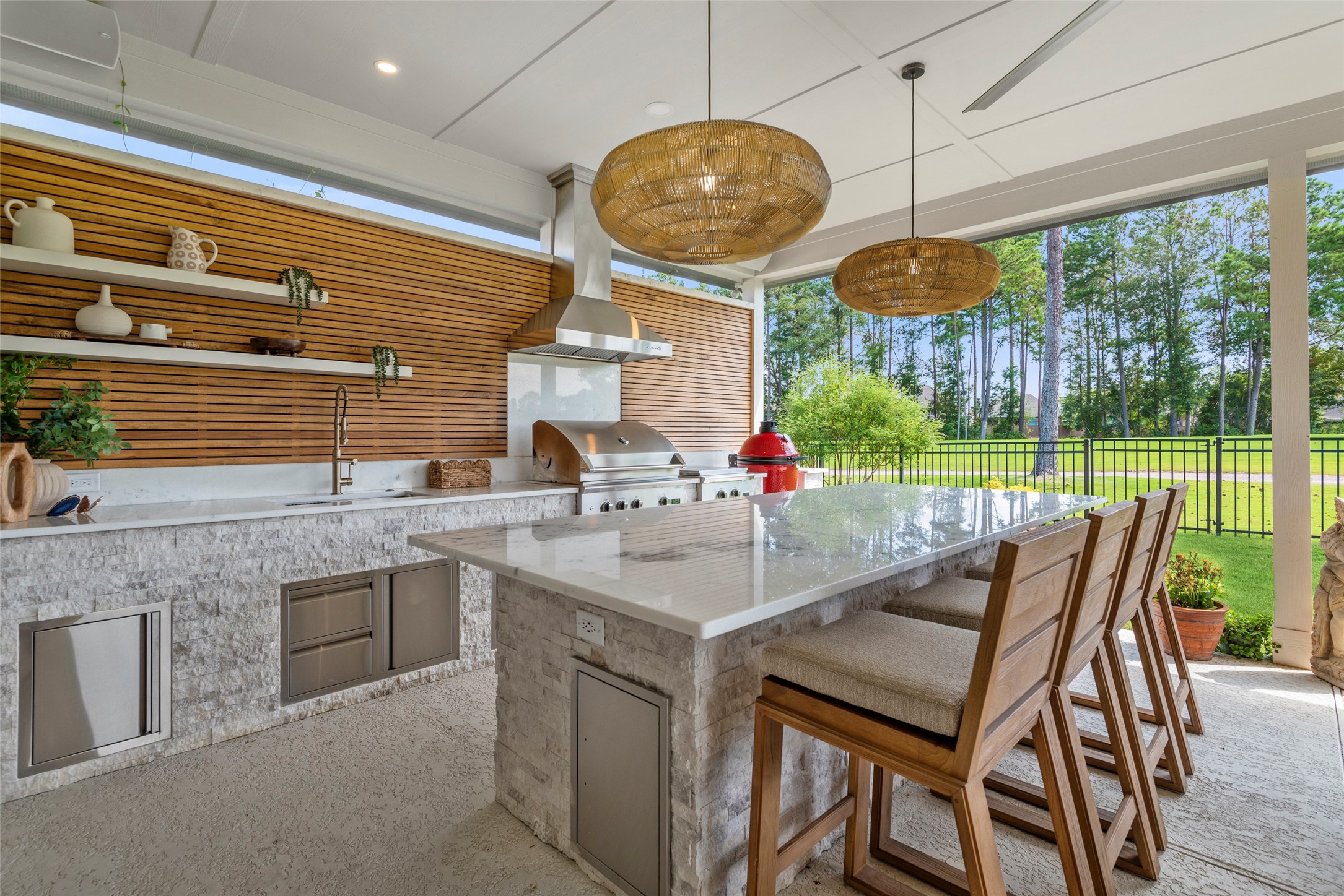 a kitchen with a table chairs and a chandelier