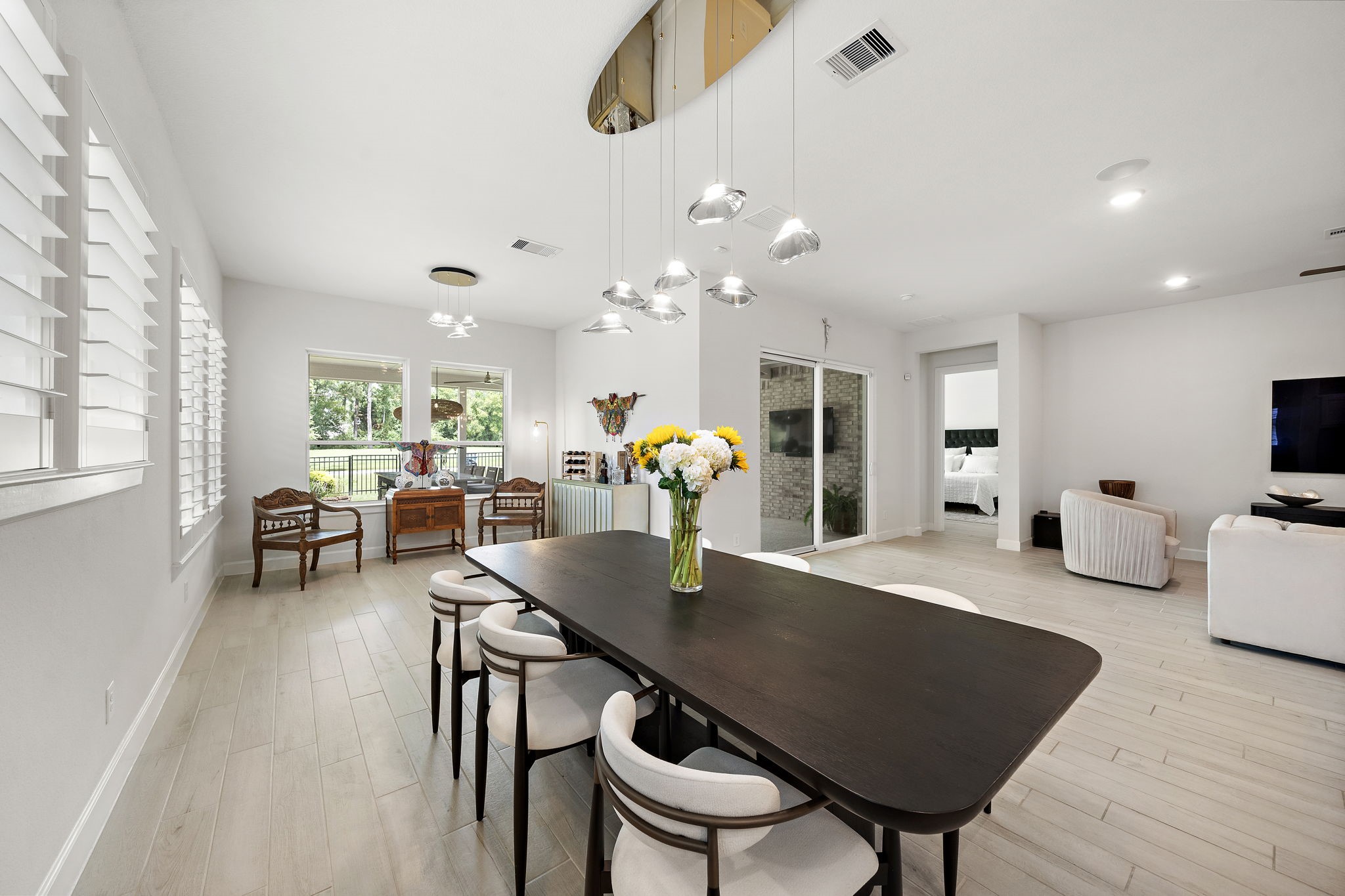 7519 Congress Trl Way Porter, TX 77365 - Photo 13 of 44 a view of a dining room with furniture and wooden floor