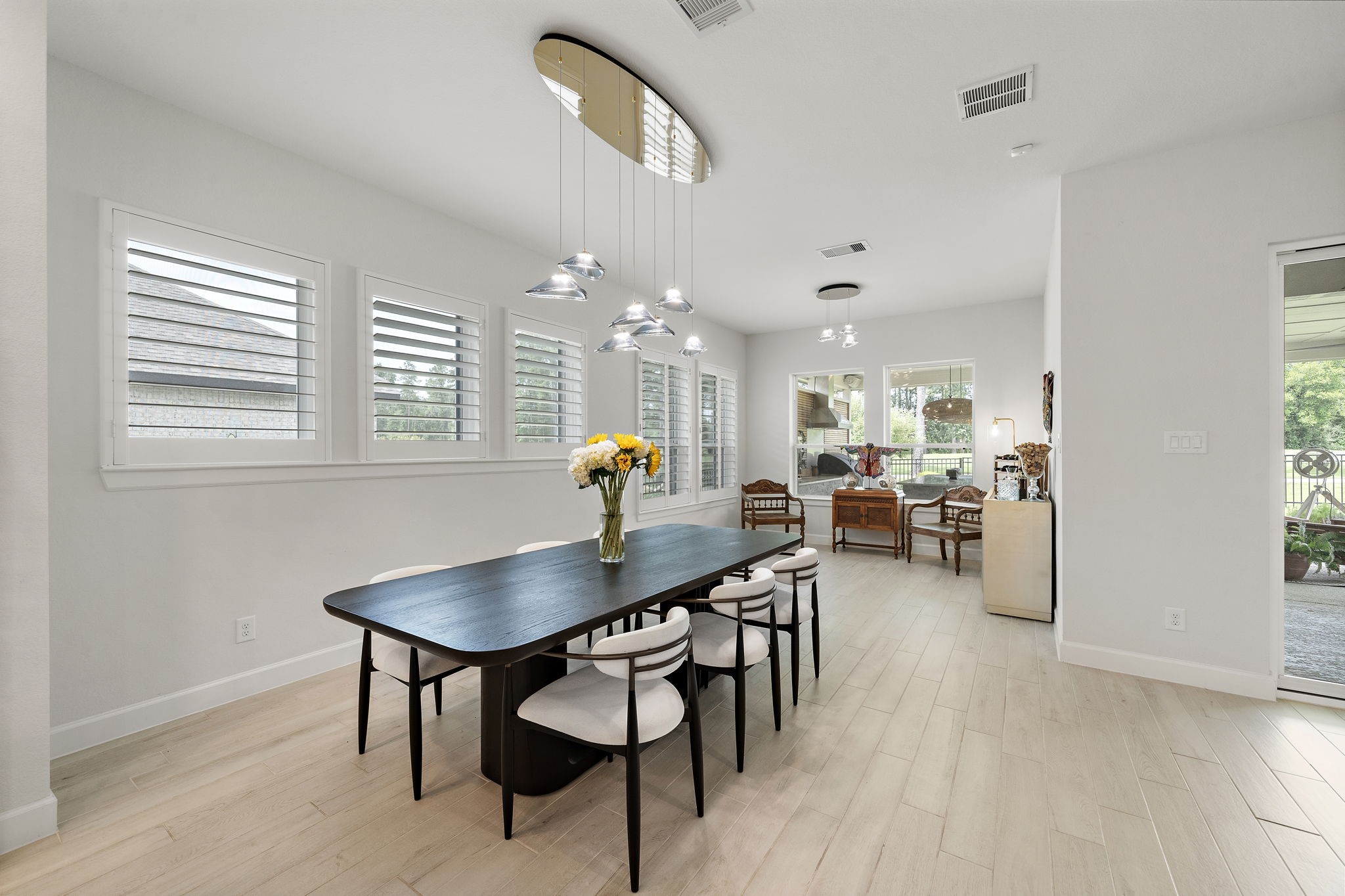 7519 Congress Trl Way Porter, TX 77365 - Photo 15 of 44 a view of a dining room with furniture and wooden floor