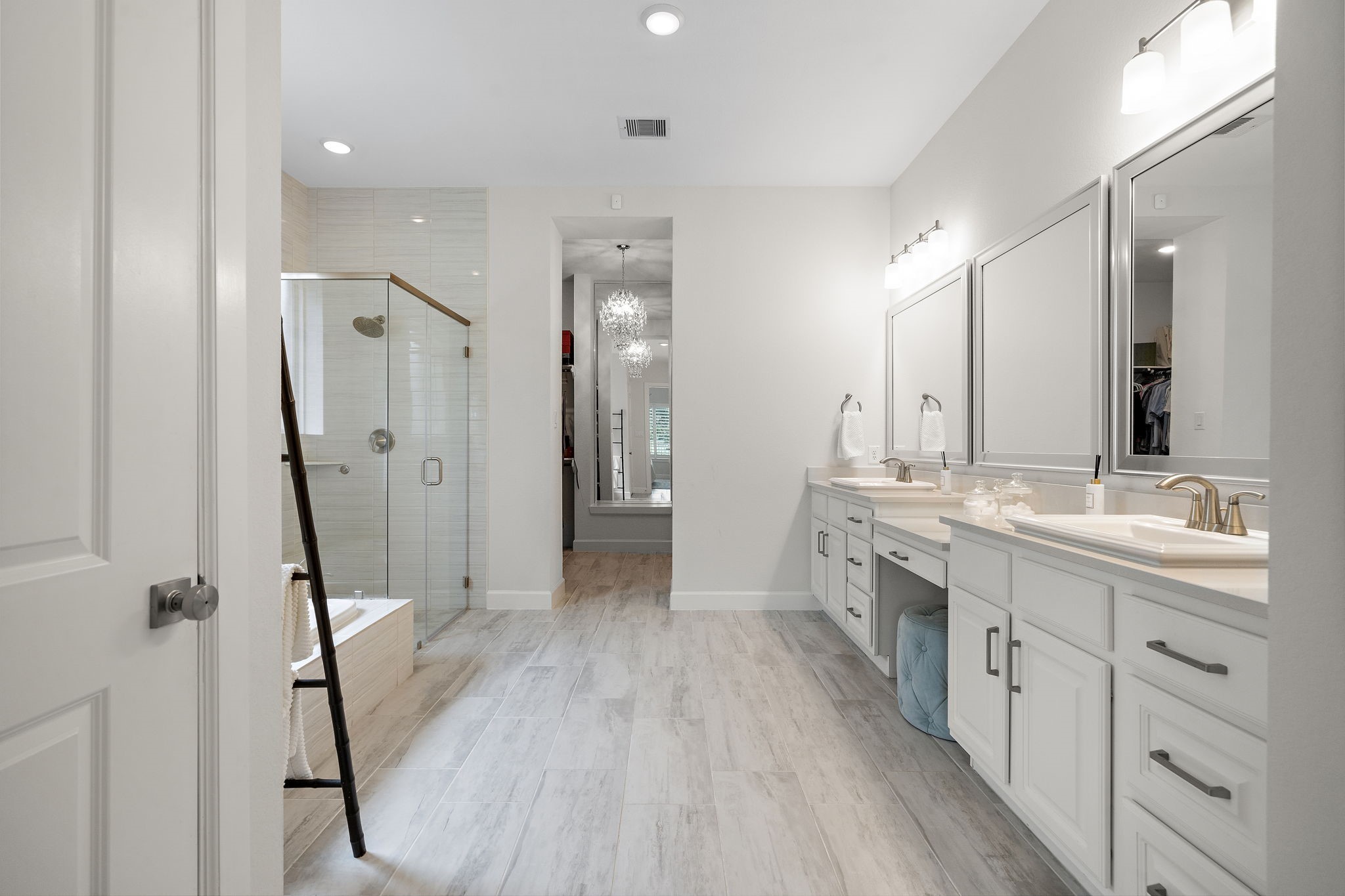 7519 Congress Trl Way Porter, TX 77365 - Photo 19 of 44 a bathroom with a double vanity sink a mirror and a shower