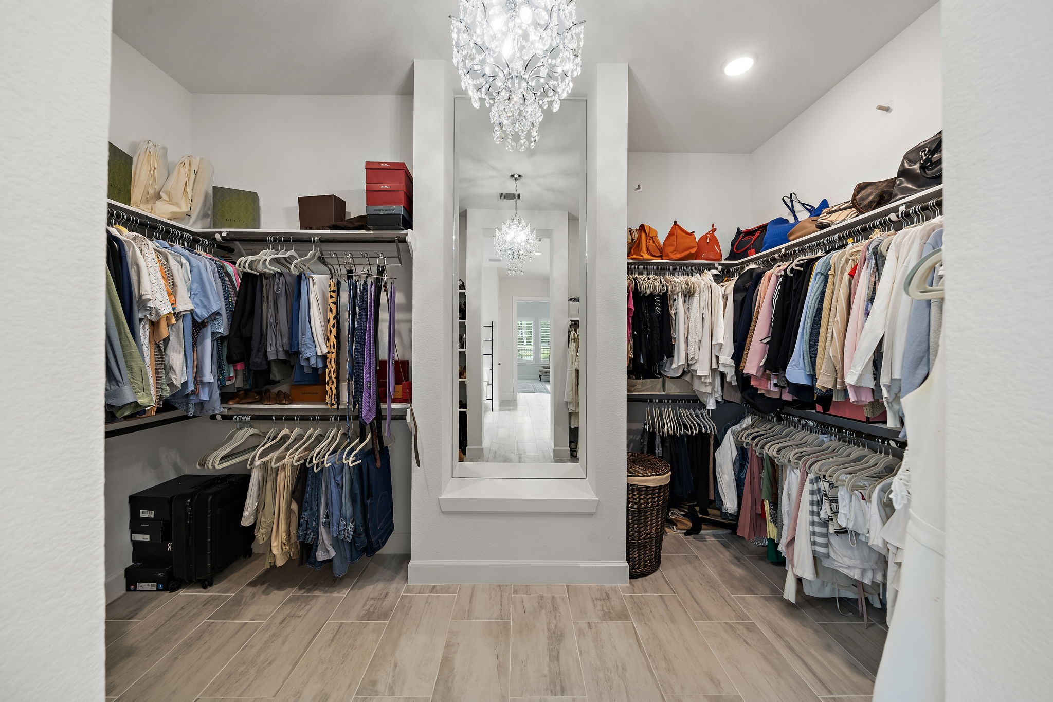 7519 Congress Trl Way Porter, TX 77365 - Photo 20 of 44 a view of walk in closet with clothes and shoes