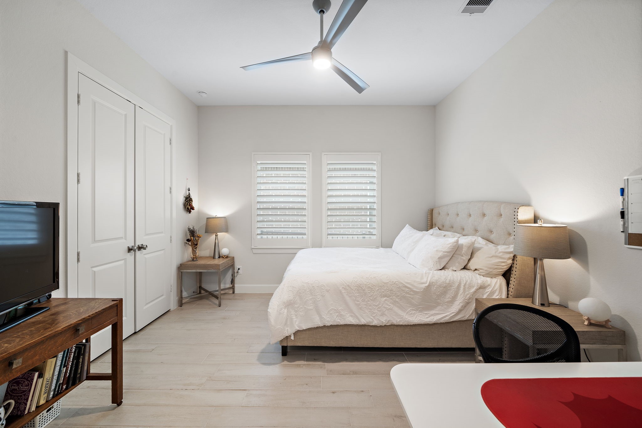 7519 Congress Trl Way Porter, TX 77365 - Photo 27 of 44 a bedroom with a bed and a flat screen tv
