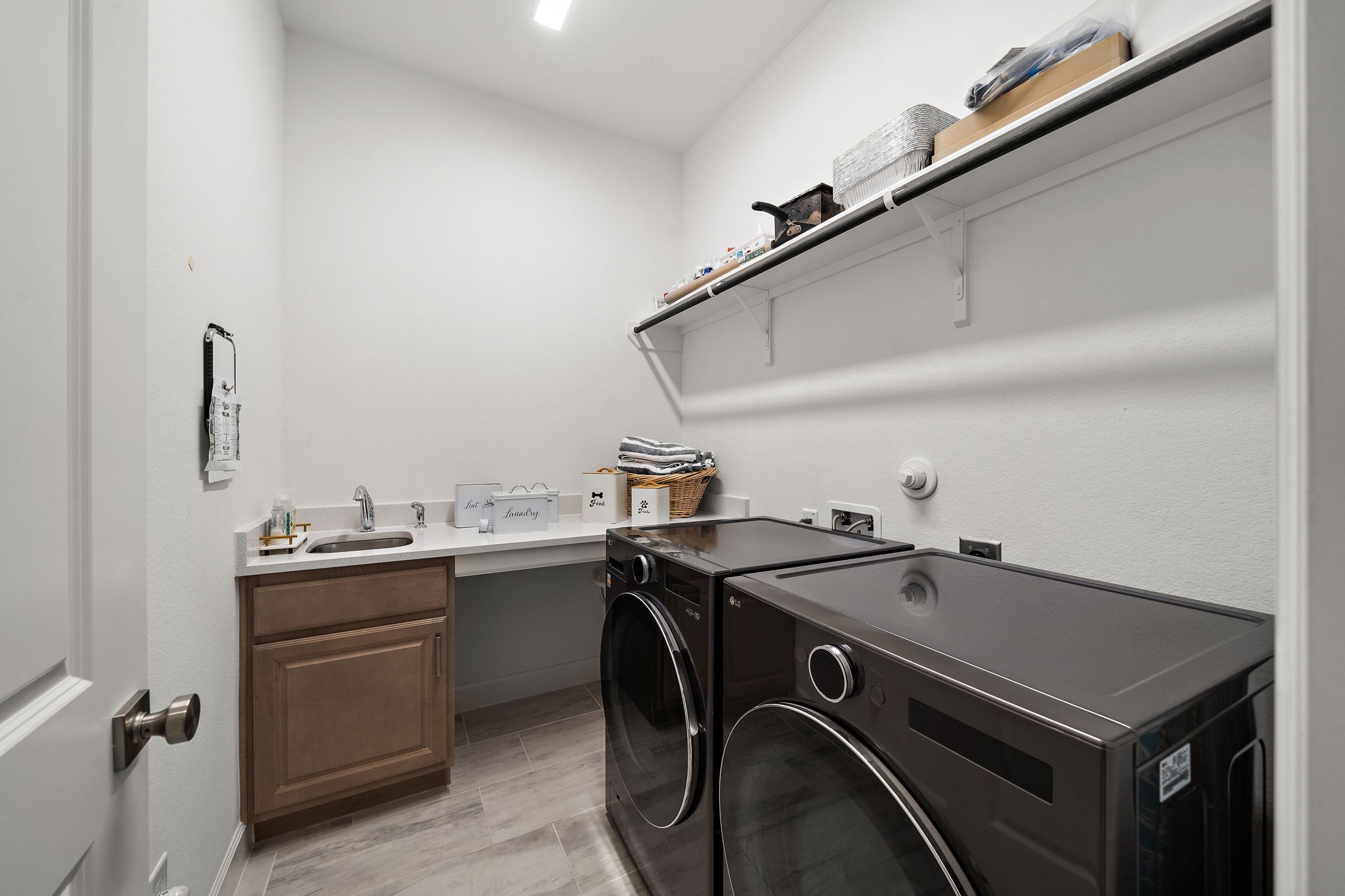 7519 Congress Trl Way Porter, TX 77365 - Photo 30 of 44 a utility room with sink dryer and washer