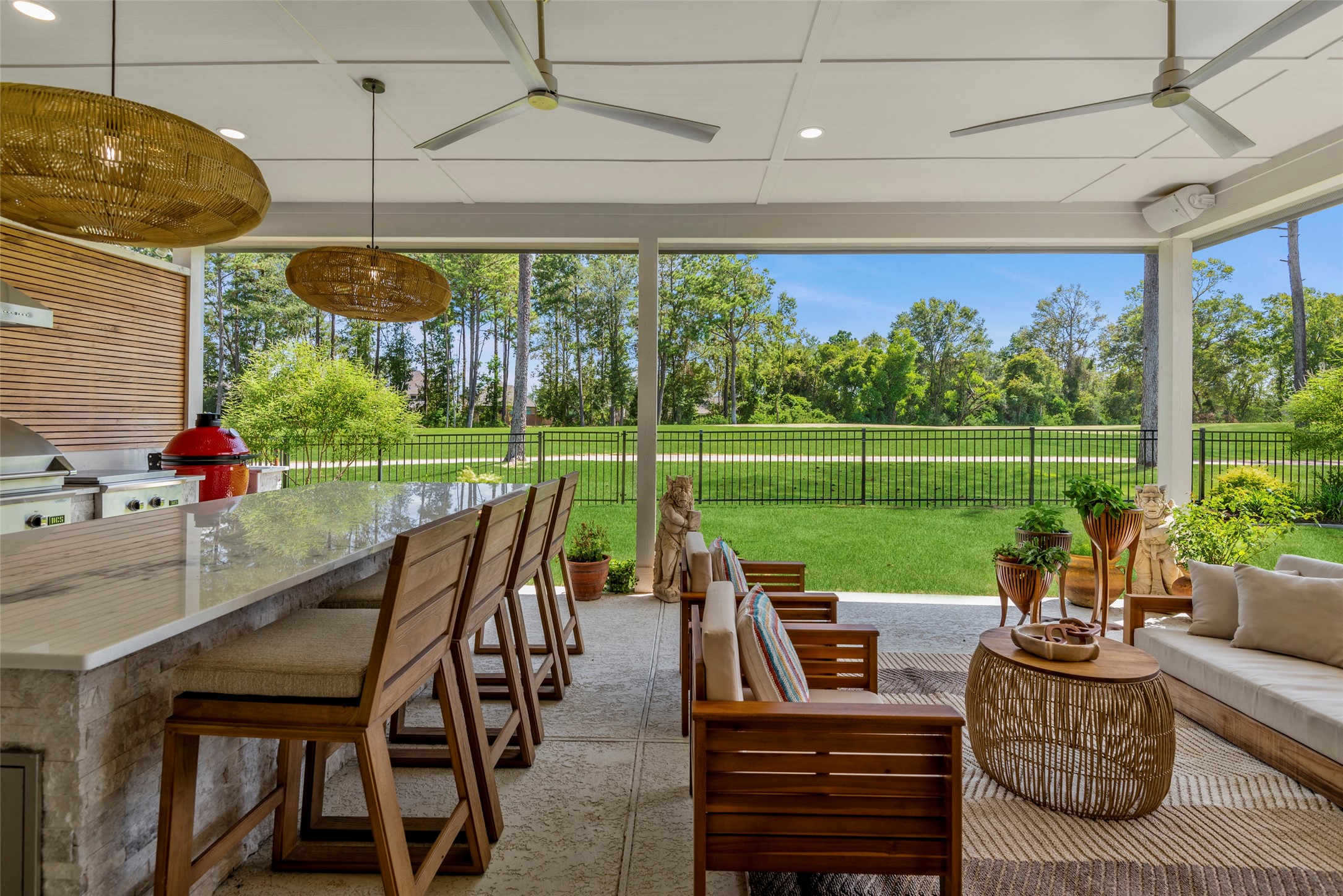7519 Congress Trl Way Porter, TX 77365 - Photo 31 of 44 a view of a patio with couches chairs dining table and chairs