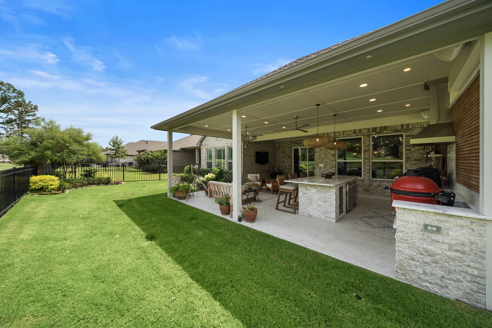 7519 Congress Trl Way Porter, TX 77365 - Photo 37 of 44 a view of a backyard with sitting area and garden