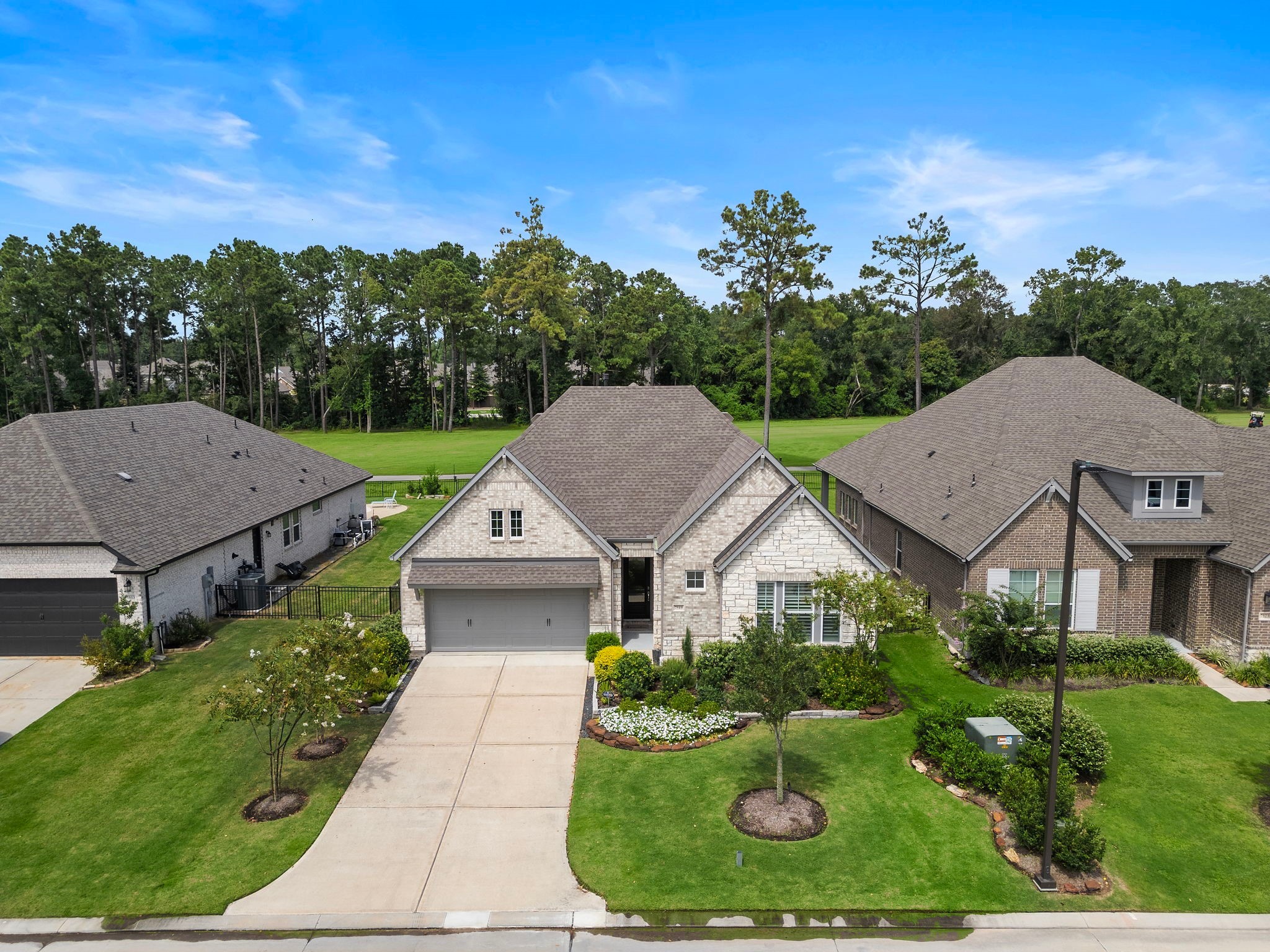 7519 Congress Trl Way Porter, TX 77365 - Photo 4 of 44 a aerial view of a house with yard and green space