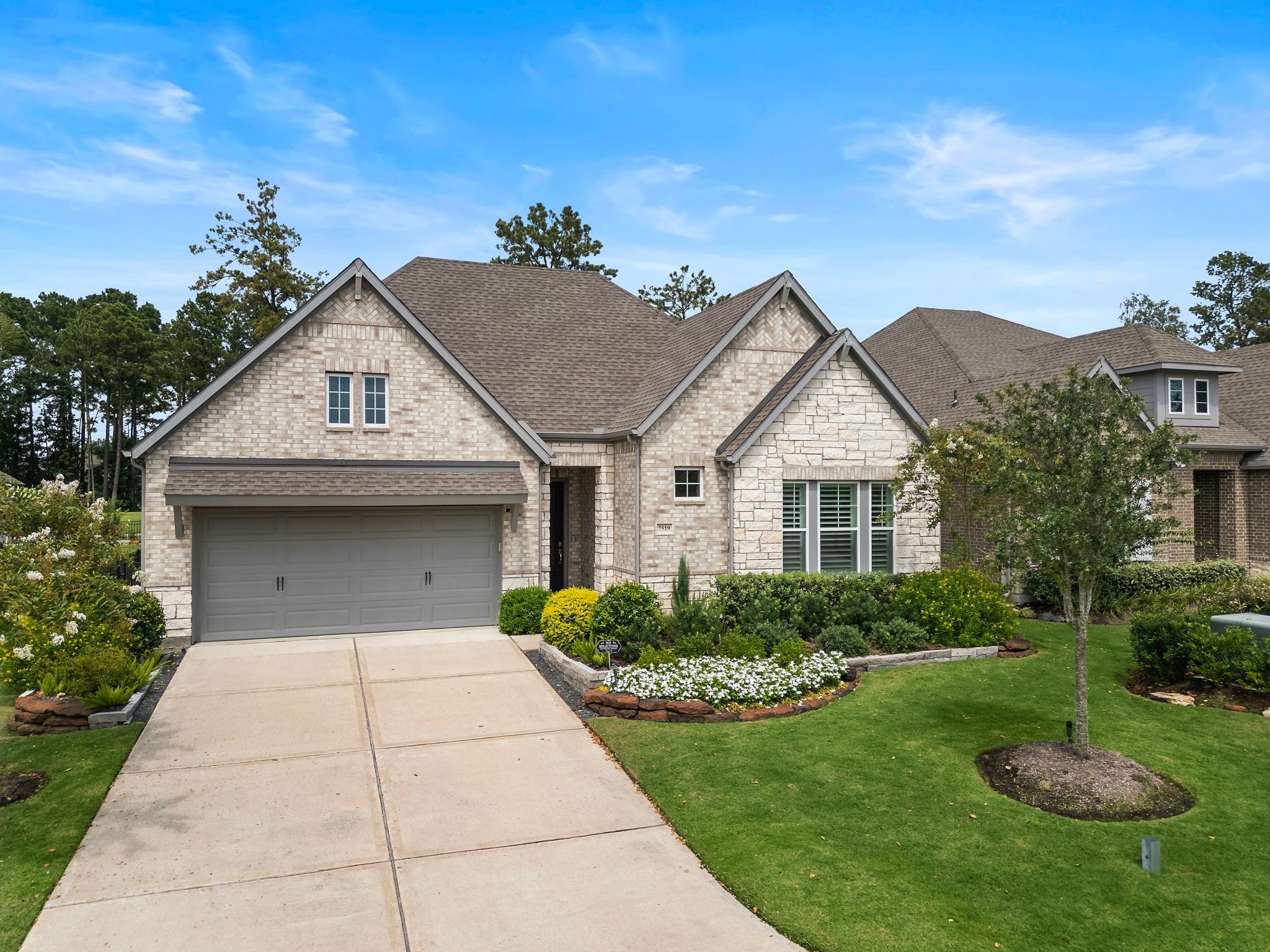 7519 Congress Trl Way Porter, TX 77365 - Photo 5 of 44 a front view of a house with garden