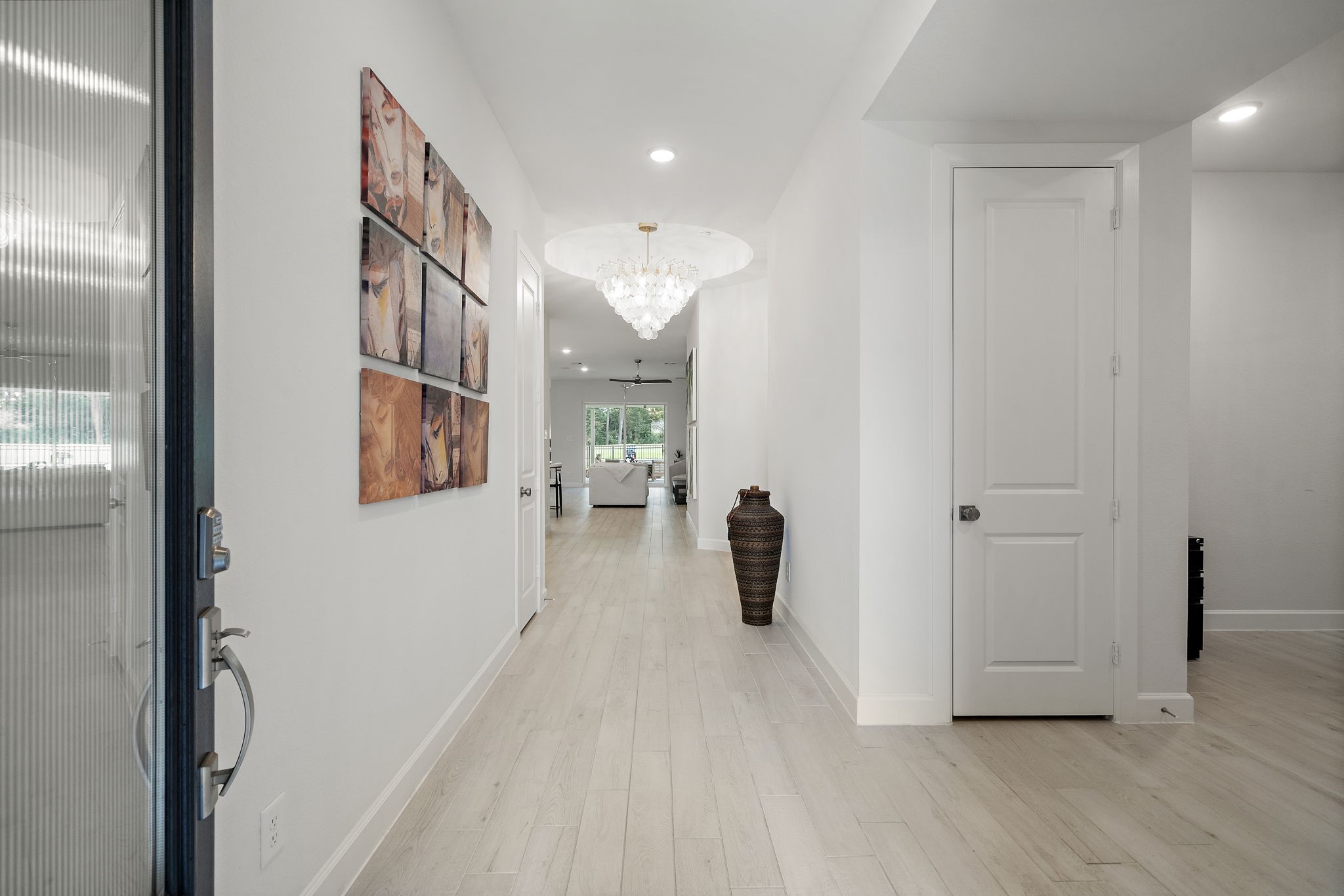7519 Congress Trl Way Porter, TX 77365 - Photo 6 of 44 a view of a hallway with wooden floor and a living room