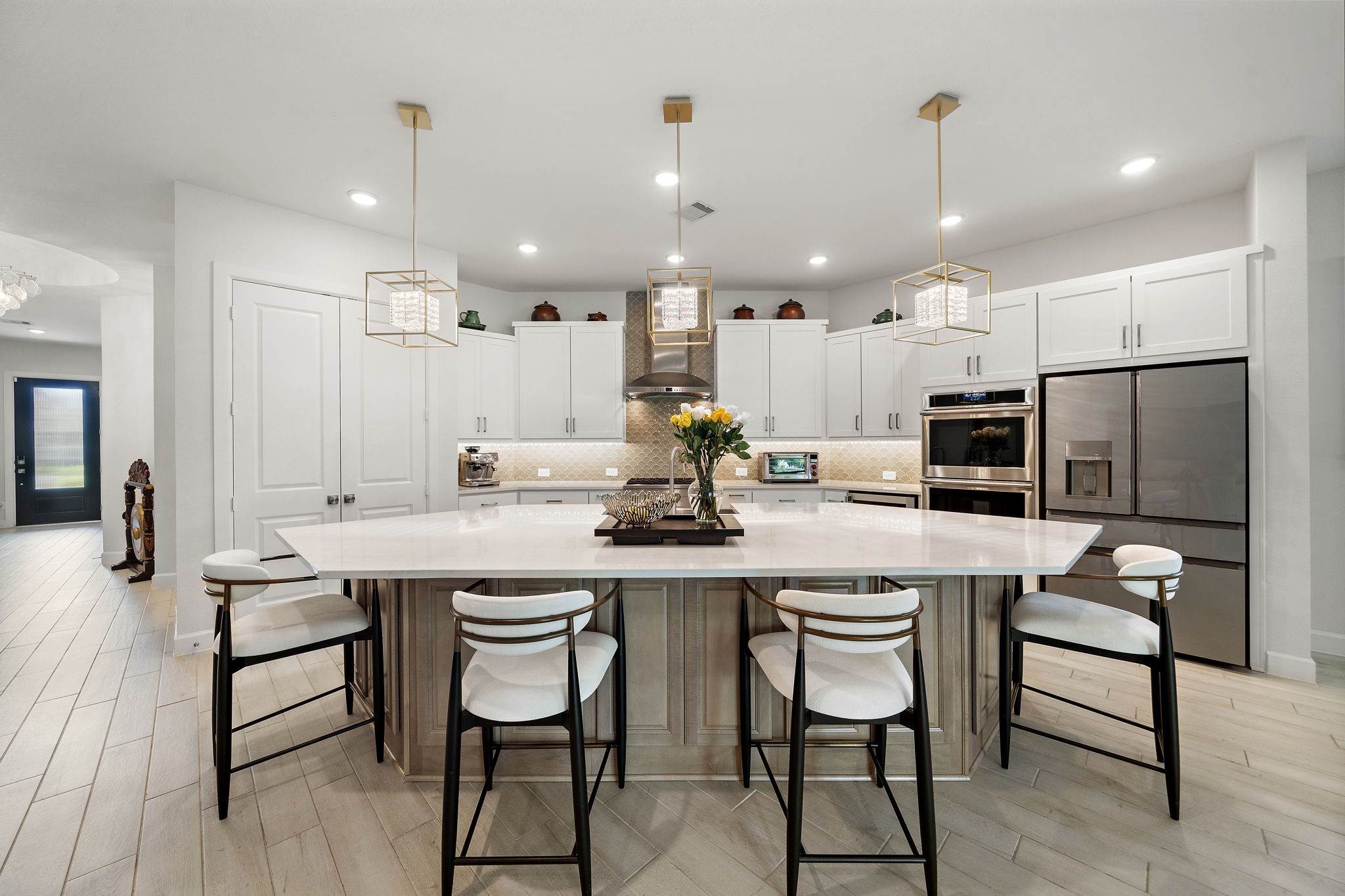 7519 Congress Trl Way Porter, TX 77365 - Photo 8 of 44 a kitchen with stainless steel appliances kitchen island granite countertop a dining table chairs and sink