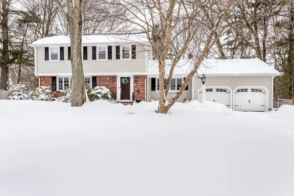 a view of a white house with snow