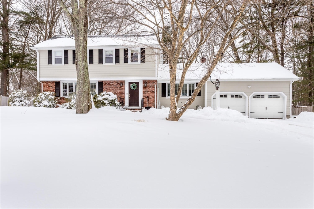 a view of a white house with snow