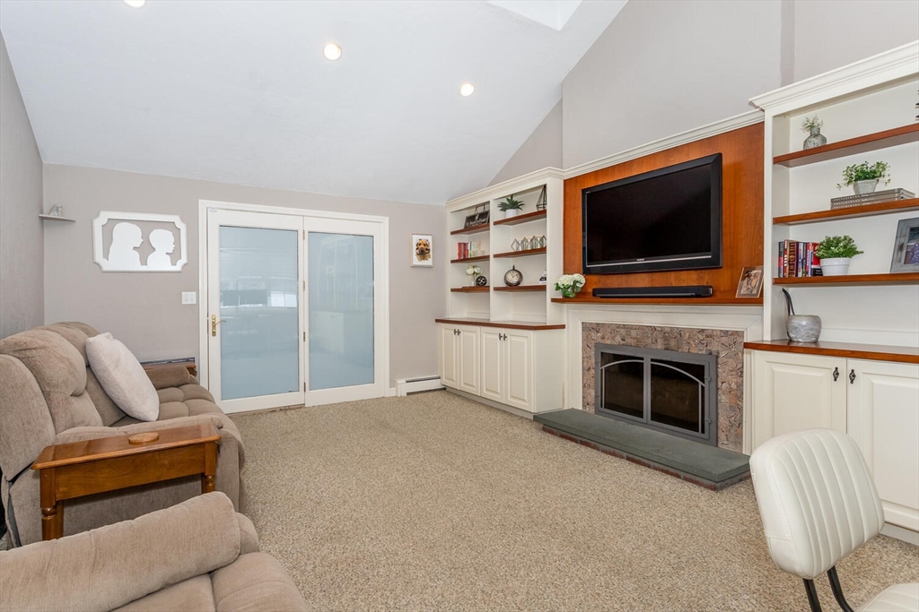 74 Cedarcrest Road Canton, MA 02021 - Photo 11 of 28 a living room with furniture and a flat screen tv