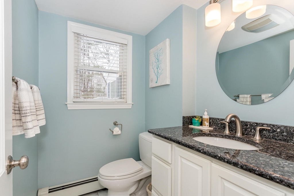 74 Cedarcrest Road Canton, MA 02021 - Photo 12 of 28 a bathroom with a granite countertop toilet sink and mirror
