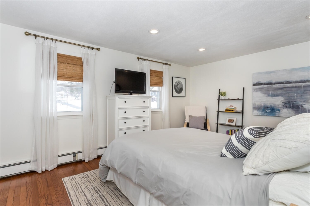 74 Cedarcrest Road Canton, MA 02021 - Photo 15 of 28 a bedroom with a bed and a flat screen tv