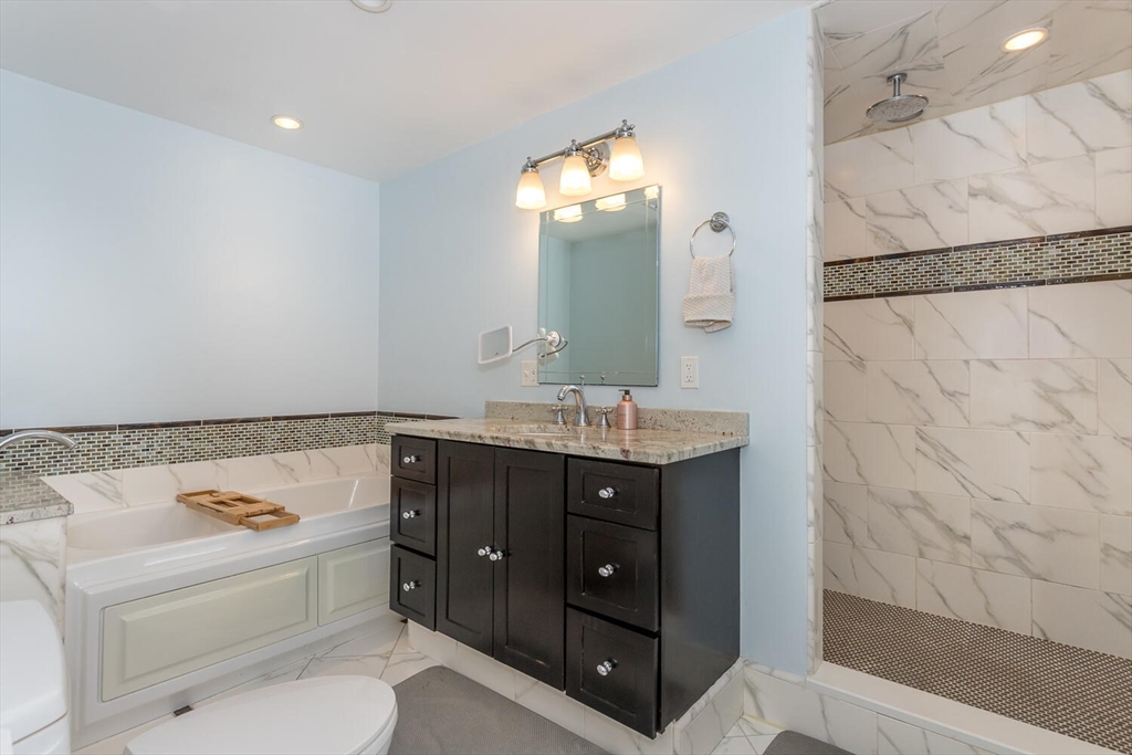 74 Cedarcrest Road Canton, MA 02021 - Photo 16 of 28 a bathroom with a sink vanity granite toilet tub and shower