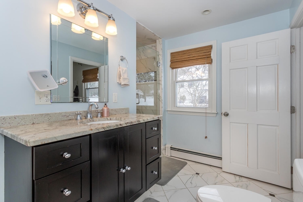 74 Cedarcrest Road Canton, MA 02021 - Photo 17 of 28 a bathroom with a granite countertop sink toilet and shower