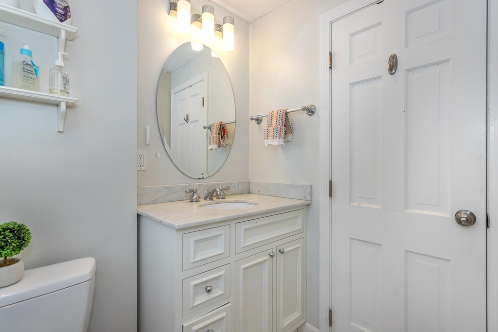 74 Cedarcrest Road Canton, MA 02021 - Photo 20 of 28 a bathroom with a sink a toilet and a mirror