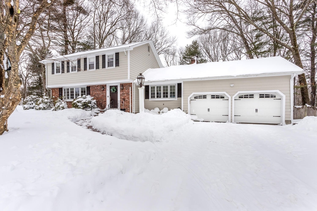 74 Cedarcrest Road Canton, MA 02021 - Photo 2 of 28 a view of a white house with a yard covered in snow