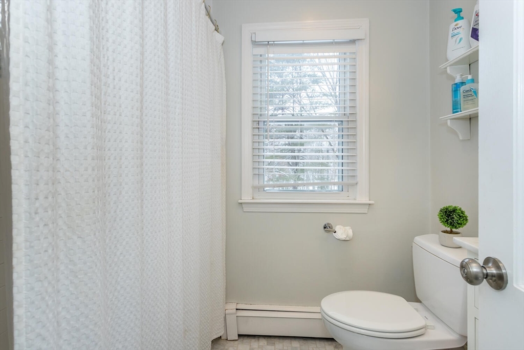 74 Cedarcrest Road Canton, MA 02021 - Photo 21 of 28 a white toilet sitting next to a window
