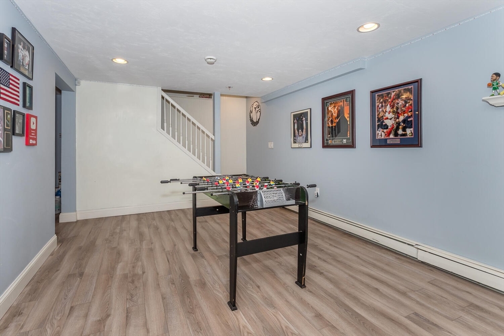 74 Cedarcrest Road Canton, MA 02021 - Photo 24 of 28 a workspace with furniture and wooden floor